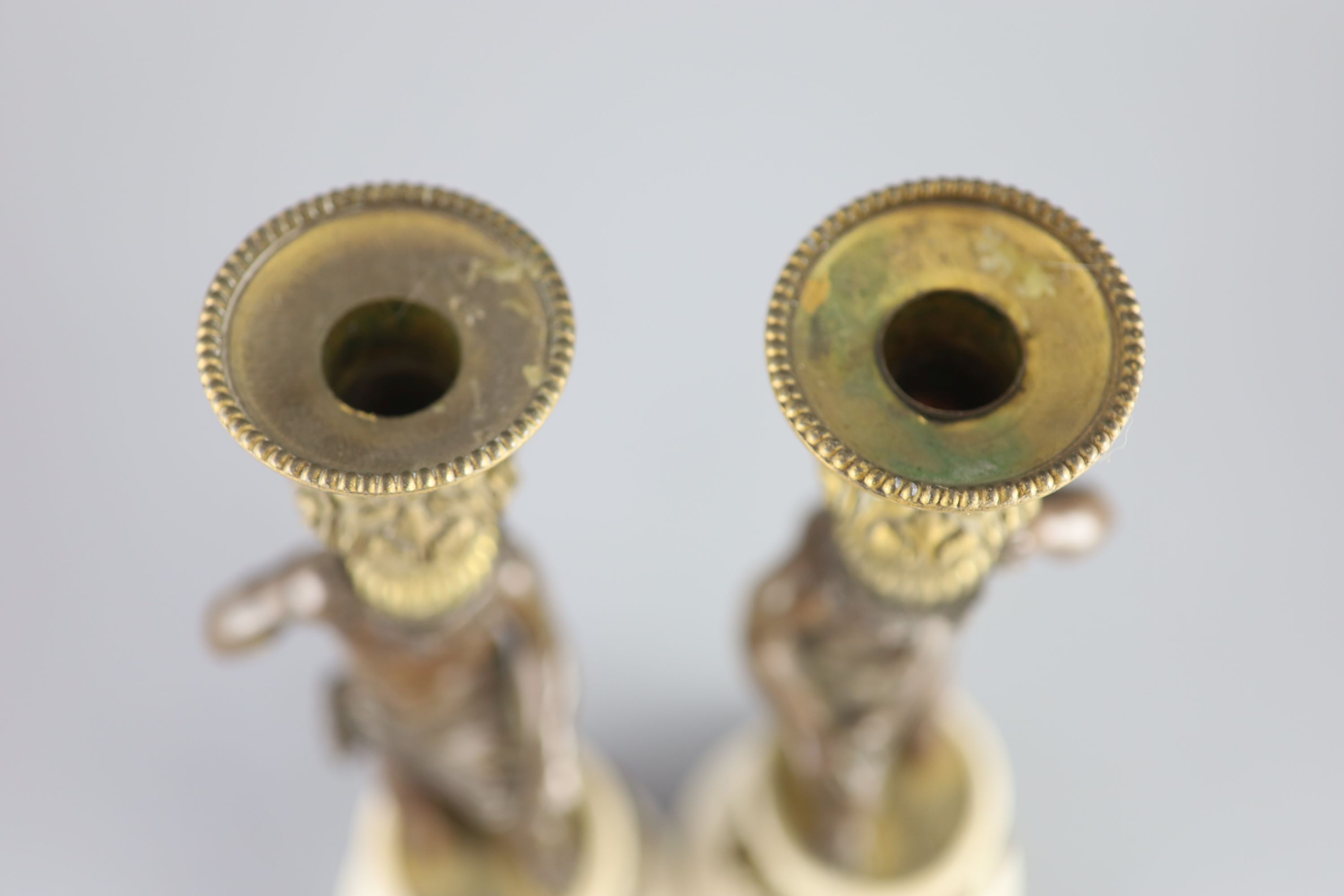 A pair of 19th century bronze and ormolu figural candlesticks, 33cm high.